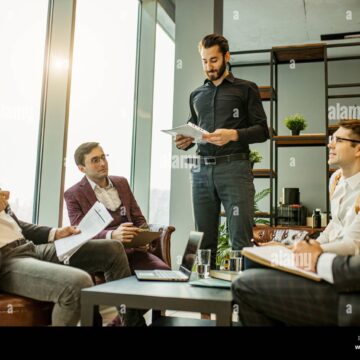teamwork-of-young-caucasian-bearded-leaders-in-modern-office-successful-and-effective-coworking-of-business-group-consisted-only-of-men-2CEYFRE