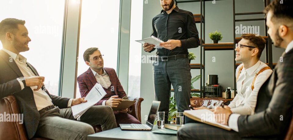 teamwork-of-young-caucasian-bearded-leaders-in-modern-office-successful-and-effective-coworking-of-business-group-consisted-only-of-men-2CEYFRE