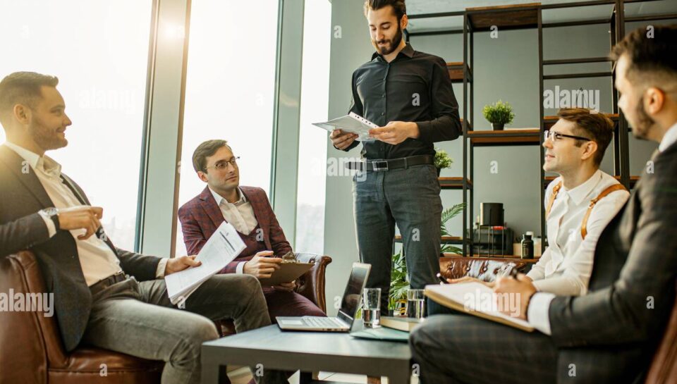 teamwork-of-young-caucasian-bearded-leaders-in-modern-office-successful-and-effective-coworking-of-business-group-consisted-only-of-men-2CEYFRE teamwork-of-young-caucasian-bearded-leaders-in-modern-office-successful-and-effective-coworking-of-business-group-consisted-only-of-men-2CEYFRE